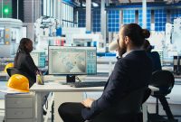 Photovoltaics factory engineer drinking coffee analyzing data